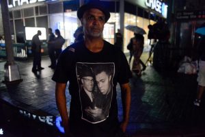 A man wears a t-shirt with a photo of Muhammad Ali during a tribute in Harlem, New York. REUTERS/Stephanie Keith