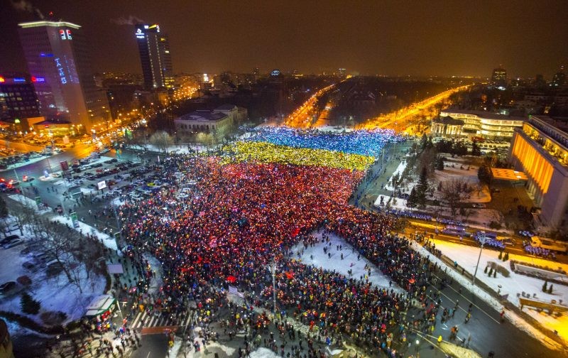 The Romanian flag took its toll over Victoriei Square during the 13th consecutive day of protests in Bucharest