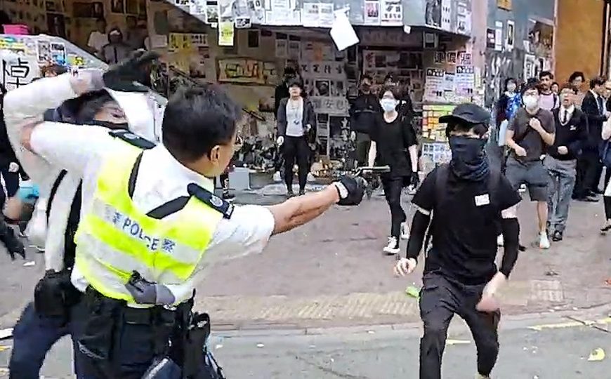 Hong Kong police shoot protester at close range, man set on fire in escalating violence
